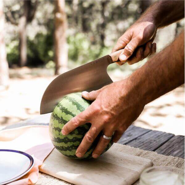 8" Chinese Santoku Cleaver with Classic Walnut Handle, shown slicing a watermelon