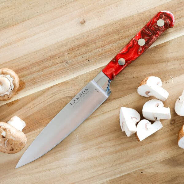 Forged 6" Utility Knife with Fire Series Handle, shown next to quartered mushrooms