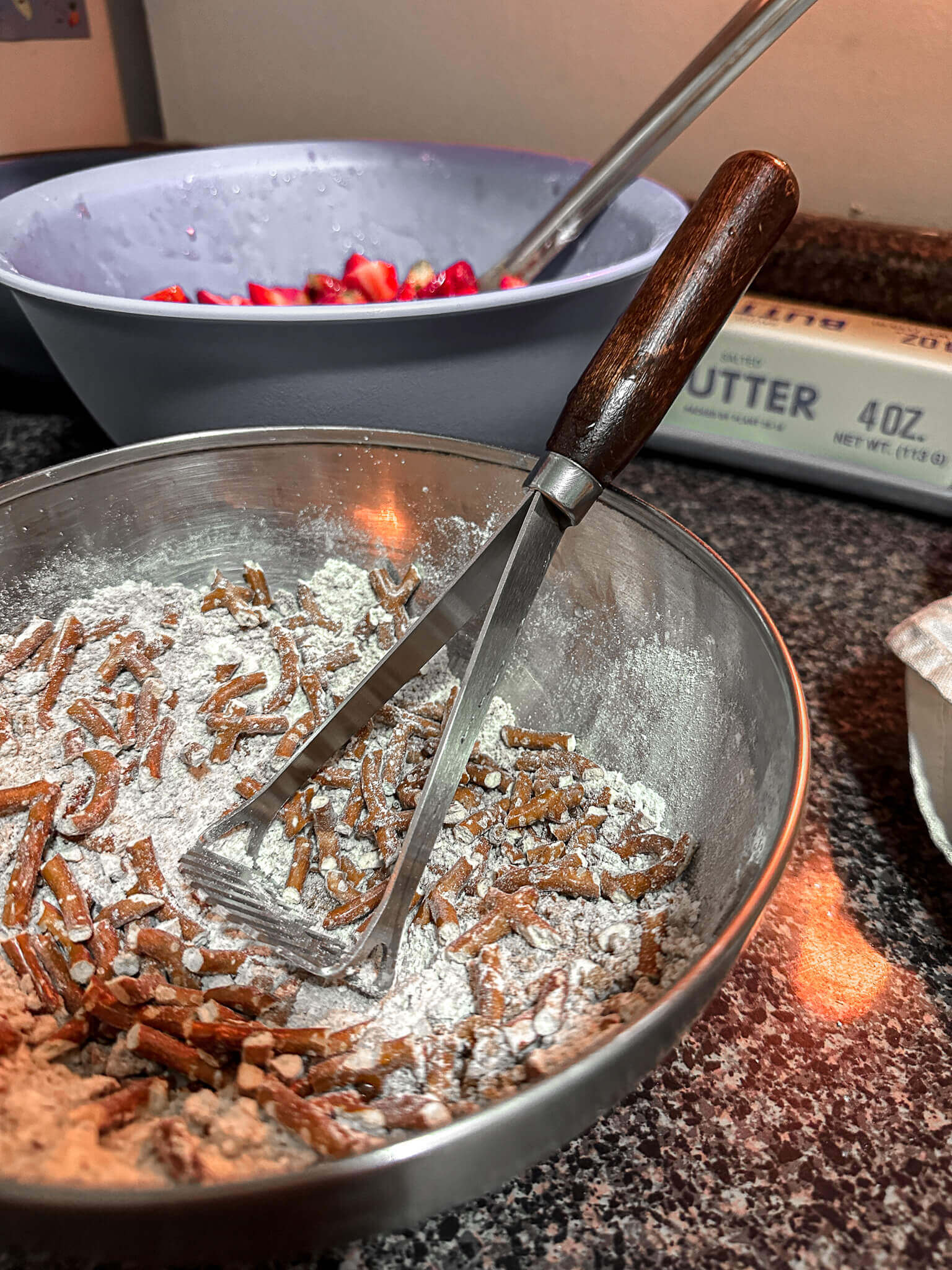 Toppings mixed with potato masher