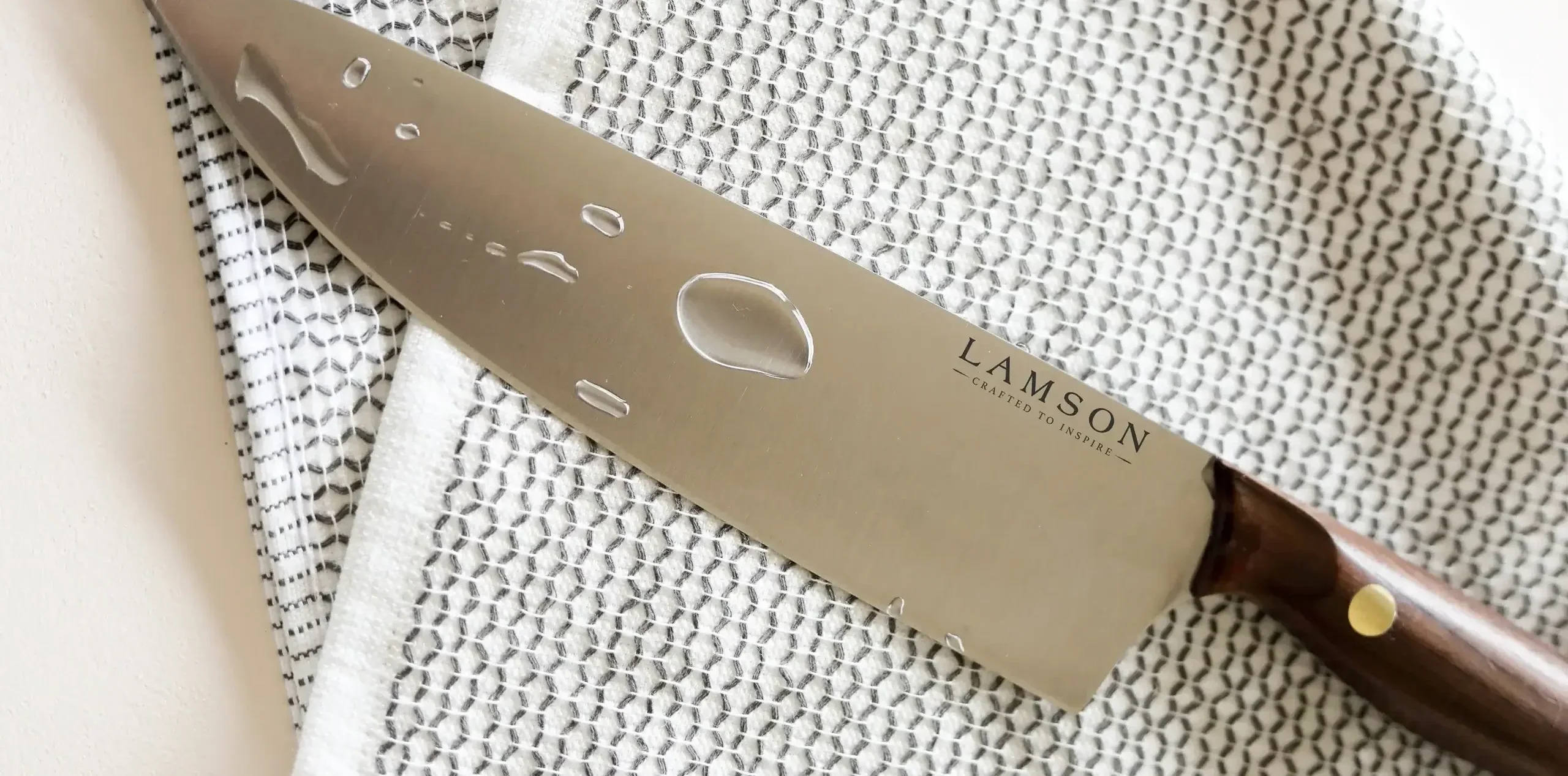 National Knife Month: Knife Care Blog. Pictured is a Vintage Chef Knife on a Towel after a Handwashing.